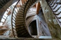 Top view of old vintage decorated spiral staircase in abandoned mansion Royalty Free Stock Photo