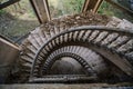 Top view of old vintage decorated spiral taircase in abandoned mansion Royalty Free Stock Photo