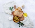 Top view Olive oil, green Olives, garlic and toast bread Royalty Free Stock Photo