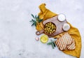 Top view Olive oil, green Olives, garlic and toast bread on a table, Royalty Free Stock Photo