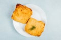 Top view of omelet bread with dill on a plate on a turquoise surface Royalty Free Stock Photo