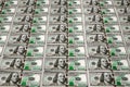 Top view of one hundred US dollars. Many banknotes are folded on the table. A pile of bills of American dollars. Money background