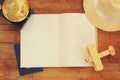 Top view of open blank notebook and polaroid blank photography frames next to cup of coffee over wooden table. ready for mockup. Royalty Free Stock Photo