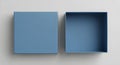 Top view of an open blue box next to its closed lid on a light gray background Royalty Free Stock Photo