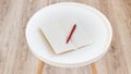 Top view of open empty blank note paper with red pen on white round journal wood table for background Royalty Free Stock Photo