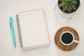 top view of open notebook with blank pages next to cup of coffee on white background. ready for adding text or mockup Royalty Free Stock Photo