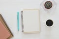 top view of open notebook with blank pages next to cup of coffee on wooden table. ready for adding text or mockup Royalty Free Stock Photo