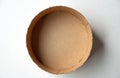 Top view of an open round cardboard box with a lid set on a plain white background surface. Empty container ready for use. It Royalty Free Stock Photo