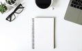 Top view of open school notebook blank pages on white office desk table with Plant and Coffee cup, eyeglasses. Business, office co Royalty Free Stock Photo