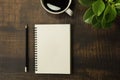 Top view of open school notebooks with blank pages, Pencil, Plant and Coffee cup on wooden table background. Business, office or e Royalty Free Stock Photo