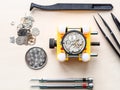 top view of open watch in yellow holder and tools Royalty Free Stock Photo