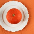 Top View Orange Pumpkin on White Plate Royalty Free Stock Photo