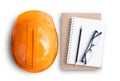 Top view with orange safety engineer helmet and blank notebook Royalty Free Stock Photo