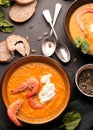 Orange tasty pumpkin soup with shrimps