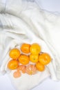 Top view Oranges fruit arranged on white fabric as background. Royalty Free Stock Photo