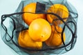 Top view of oranges in a reusable string bag