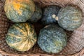 Top view of organic lumpy vegetables in a thatch basket Royalty Free Stock Photo