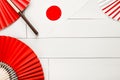 Top view of origami paper fans on a light background, traditional symbols of Japan, the concept of Independence Day, a