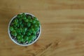 Top view. ornamental background plant in pot on wooden table wit