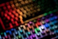 Top view out of focus image of illuminated RGB keyboard in the dark Royalty Free Stock Photo