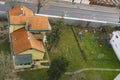 Top view outskirts private house with neighbor playground for children and car road