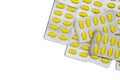 Top view of oval yellow tablets pills in blister packs. Yellow pills pattern wallpaper. Mefenamic acid tablets pills