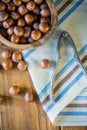 Top view over hazelnuts in bowl and nut cracker Royalty Free Stock Photo