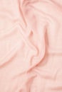 Top view over soft woolen pink textil texture
