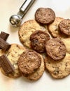 Top view of a pack of homemade chocolate chip cookies with 10gr. chocolate bars aside