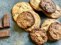 Top view of a pack of homemade chocolate chip cookies with 10gr. chocolate bars aside