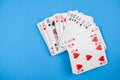Top view of a pack of playing cards isolated on a blue background Royalty Free Stock Photo