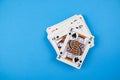 Top view of a pack of playing cards isolated on a blue background