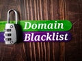 Top view padlock and colored ice cream stick with text Domain Blacklist