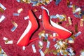 top view of pair of red feminine shoes on floor
