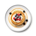 Top view of pancakes with berries and whipped cream.