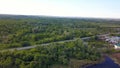 Top view of panorama of village on background of green forest. Clip. Cottage town is great place for quiet life near