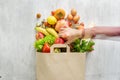 Top view paper bag different health food white wooden background Royalty Free Stock Photo