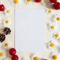 Top view of paper, camomiles, cherry berries and fir cones on a ivory background. Mockup, Summer flatlay, place for text
