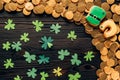 top view of paper shamrock and golden coins on wooden table, st patricks day concept Royalty Free Stock Photo