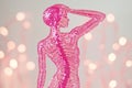 A top view of a paper uterus decorated with sequins, set against a pink background, is a visual representation of Royalty Free Stock Photo
