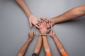 Top view of parents and children holding the shape of a residen