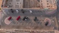 Top view parking lot with many cars moving in and out timelapse.