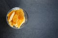 Top view of parmesan cheese cracker chips an a glas bowl, this is a simple easy snack for party or event on a dark stone Royalty Free Stock Photo