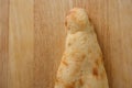 Part of traditional Georgian bread on wooden board