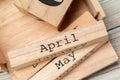 Top view of parts of wooden calendar on dark wooden tabletop