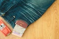 Top view. passport book and money insert on pocket blue jean pan Royalty Free Stock Photo