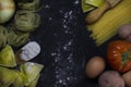 Top view of pasta food ,cooking background with a copy space of ravioli, spaghetti,egg,potato,tomato and a wood kneader on floury Royalty Free Stock Photo