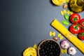 Top view: pasta or italian spaghetti on black stone slate background Royalty Free Stock Photo