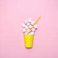 Top view of the pastel marshmallows on a pink background. Minimal style. Royalty Free Stock Photo