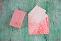 pastel pink present box and evelope with white blank paper sheet with place for text